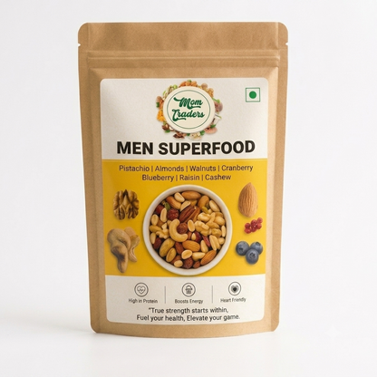A stand-up pouch of Men Superfood nuts and dried fruits by Mem Traders, featuring a kraft paper package with a large white and yellow label showing a bowl of mixed nuts and ingredients like pistachio, almonds, walnuts, cranberry, blueberry, raisin, and cashew, brazilnut, hazelnut