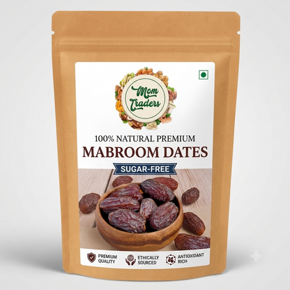 A stand-up pouch of Mom Traders 100% Natural Premium Mabroom Dates, sugar-free. The packaging is a light brown kraft paper style with a large white label showing a bowl of dates and product details.